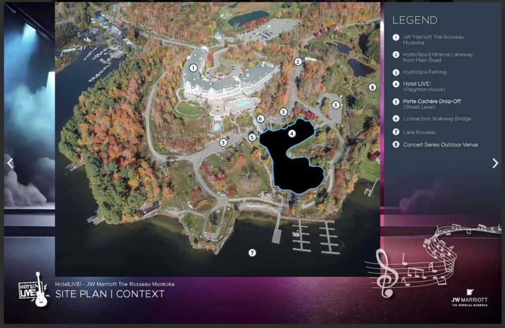 Aerial view of Muskoka cottage resort with lake, docks, and surrounding autumn foliage.