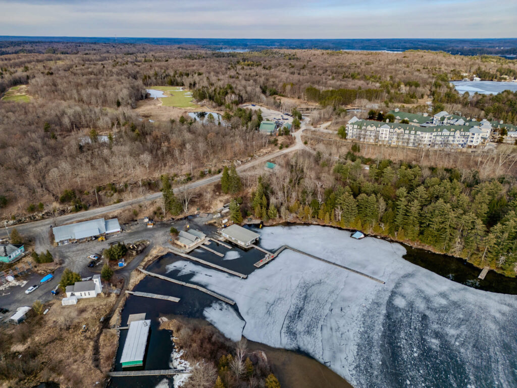 Aerial view of Wallace Bay and the existing Clevelands House marina, with JW Marriott The Rosseau visible across the bay, showing the area proposed for the expanded 215-slip marina in the Clevelands House Minett development.
