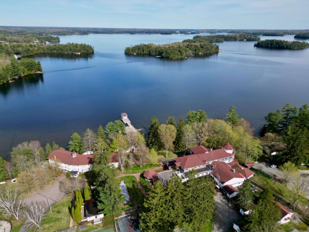 Aerial view of the Clevelands House Minett development area on Lake Rosseau in Muskoka, showing the historic resort buildings and waterfront.