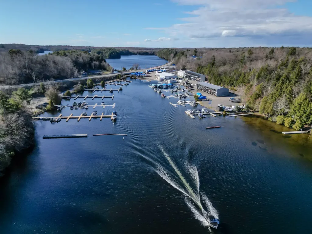 Aerial view of Gordon Bay Marine on Lake Joseph showing boat slips, service buildings, and marina traffic.